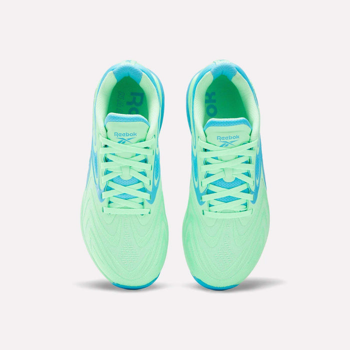 Top view of Women's Nano X5 Edge Training Shoes by Reebok in neon green with light blue accents, laces, and lining, shown side by side on a white background—perfect for your next HIIT class.