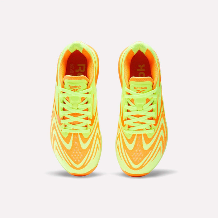 Top view of Reebok Women's Nano X5 Edge Training Shoes in neon yellow and orange with wave patterns and matching laces, ideal for HIIT workouts, shown on a plain white background.