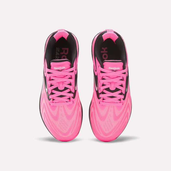 A pair of Women's Nano X5 Edge Training Shoes by Reebok in bright pink with black accents, pink laces, and a bold wavy pattern—ideal for your next HIIT session.