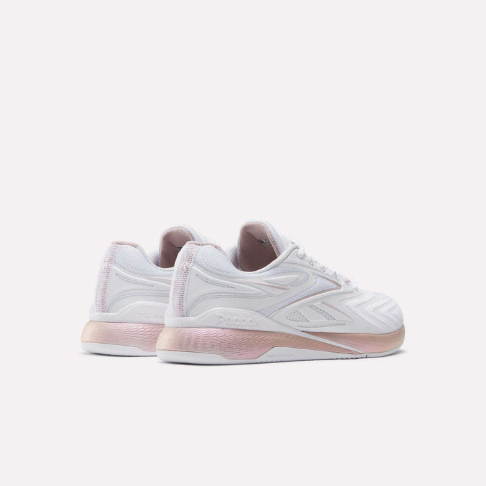 Reebok Women's Nano X5 Edge Training Shoes in white with pale pink heel and sole accents, displayed from a rear-side angle on a light background.