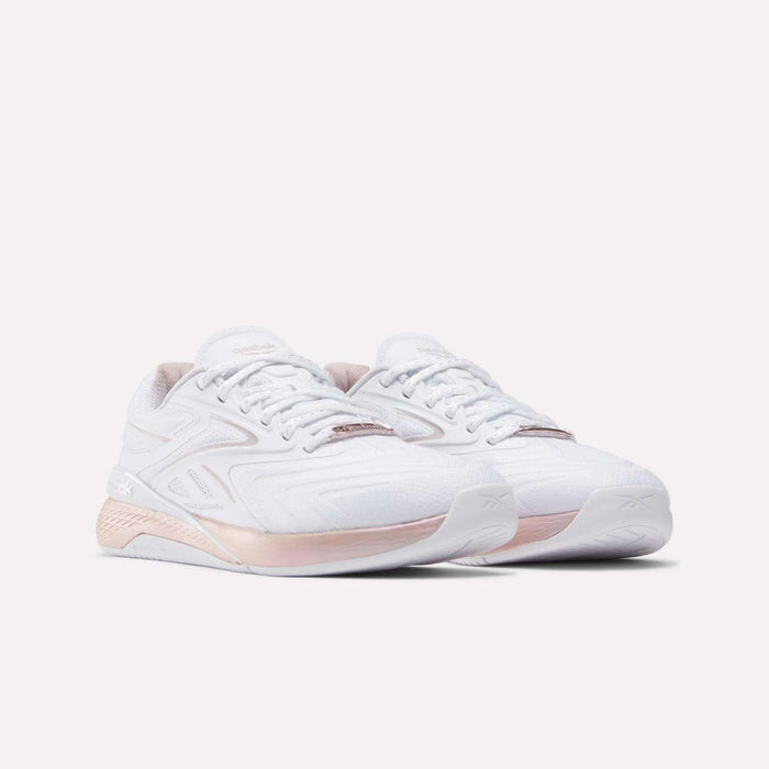 Reebok Women's Nano X5 Edge Training Shoes in white with light pink accents on the sole and heel, shown against a plain white background.