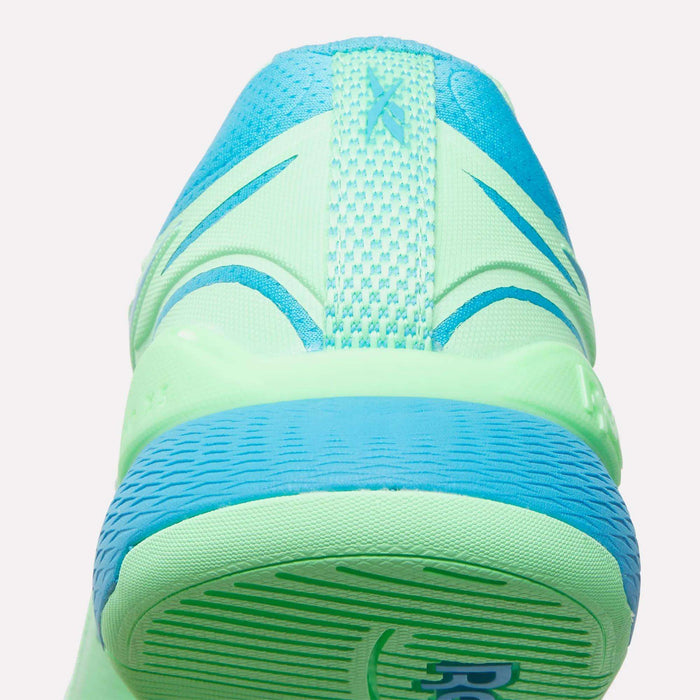 Close-up rear view of neon green and blue Reebok Women's Nano X5 Edge Training Shoes, featuring a textured heel, mesh upper, and visible stitching—perfect for your next HIIT class.
