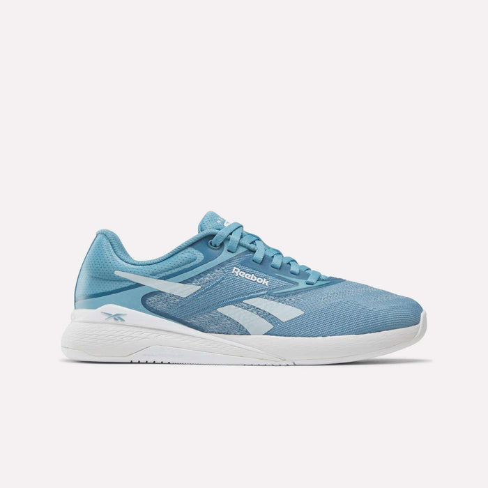 Light blue Reebok Nano X5 Women's Training Shoes with white accents, a white midsole, blue laces, and the Reebok logo on the side. Designed for comfort and performance. Shown on a plain white background.