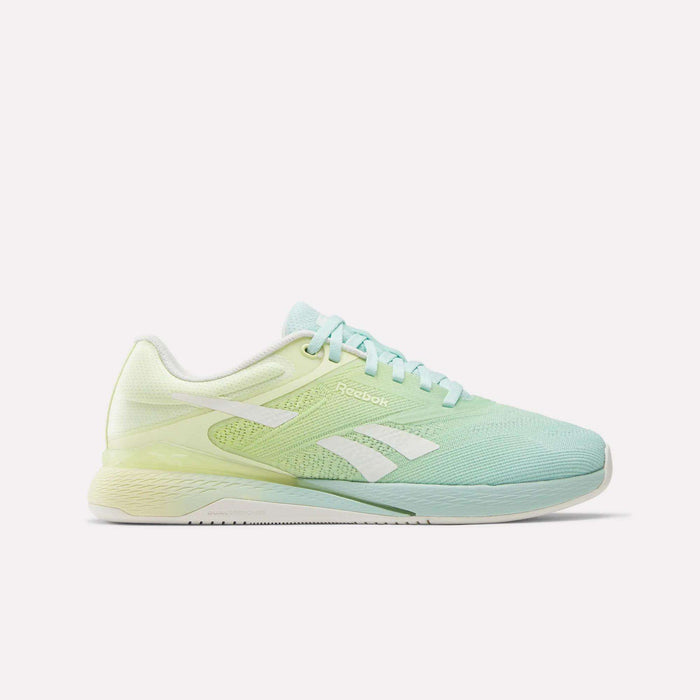 The Reebok Women's Nano X5 Training Shoes feature a gradient design from light yellow at the heel to light blue at the toe, white laces, and the iconic Reebok logo on the side. These stylish shoes offer comfort for your workouts.