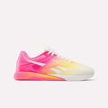 The Women's Nano X5 Training Shoes by Reebok feature a comfortable design with gradient colors fading from white at the toe to yellow and vibrant pink at the heel, white laces, and the Reebok logo—perfect for women's training sessions.