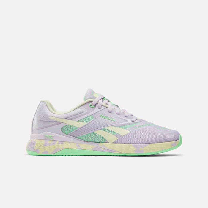 The Reebok Women's Nano X5 Training Shoes, shown on a plain white background, feature lavender with mint green and pastel yellow accents, a textured sole, and the Reebok logo on the side.