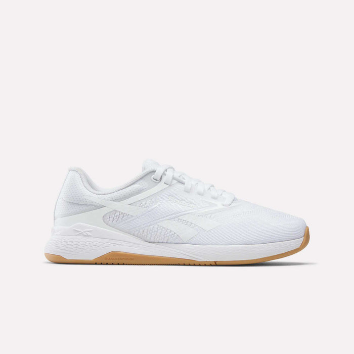 The image features the Women's Nano X5 Training Shoes by Reebok—a white athletic sneaker with a mesh upper, white laces, and a pale tan rubber sole—shown from the side against a plain light background.