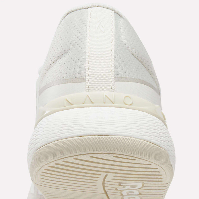 Close-up rear view of the Reebok Women's Nano X5 Training Shoes, featuring 'NANO' embossed above the textured rubber sole and subtle stitching details on the heel—perfect for women's training shoe collections.