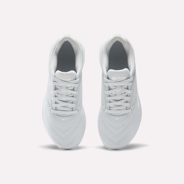 Two Reebok Women's Nano X5 Training Shoes are shown from above on a white background, highlighting their laces, breathable mesh texture, and the Reebok side logo.