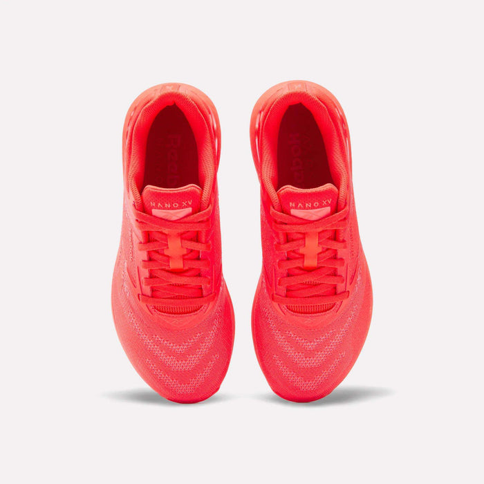 Top view of a pair of vibrant red Reebok Women's Nano X5 Training Shoes with knit uppers, placed side by side on a white background. The insoles display the brand and model, emphasizing these stylish women’s trainers.