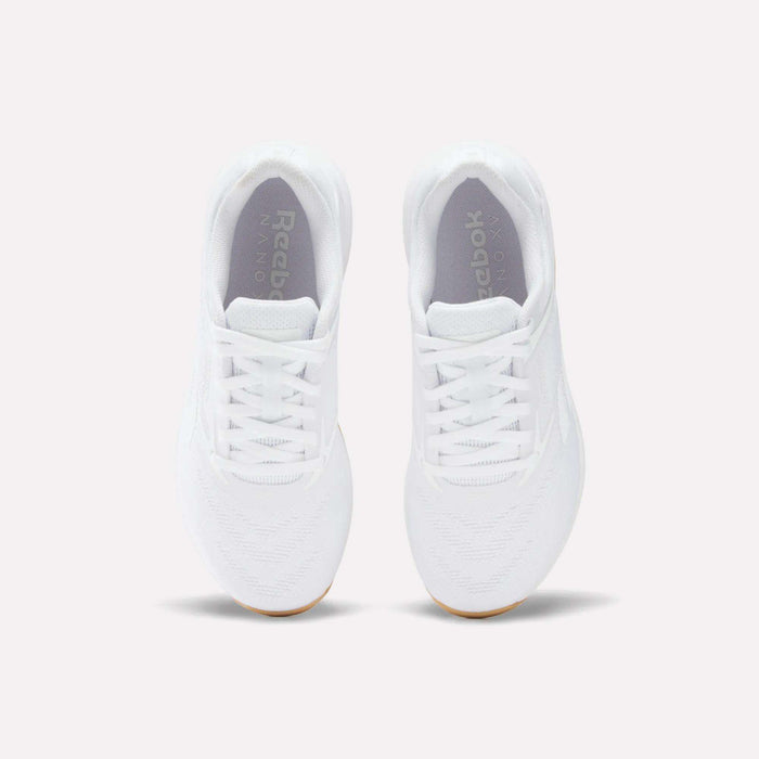 A pair of Women's Nano X5 Training Shoes by Reebok, shown from above with visible laces, toe area, and logo on the insoles, displayed against a plain light background.
