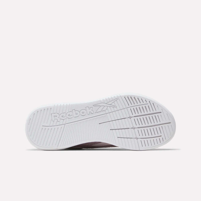 The image displays the white sole of Reebok Nano X5 Women's Training Shoes, featuring the Reebok logo, textured grip patterns, and dual-density midsole details for enhanced high-performance training.