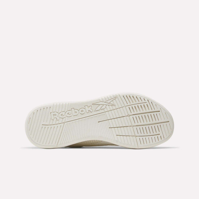 The sole of a Reebok Nano X5 Women’s Training Shoe in beige is shown facing up, highlighting the textured tread and embossed Reebok logo at the center against a plain, light background.