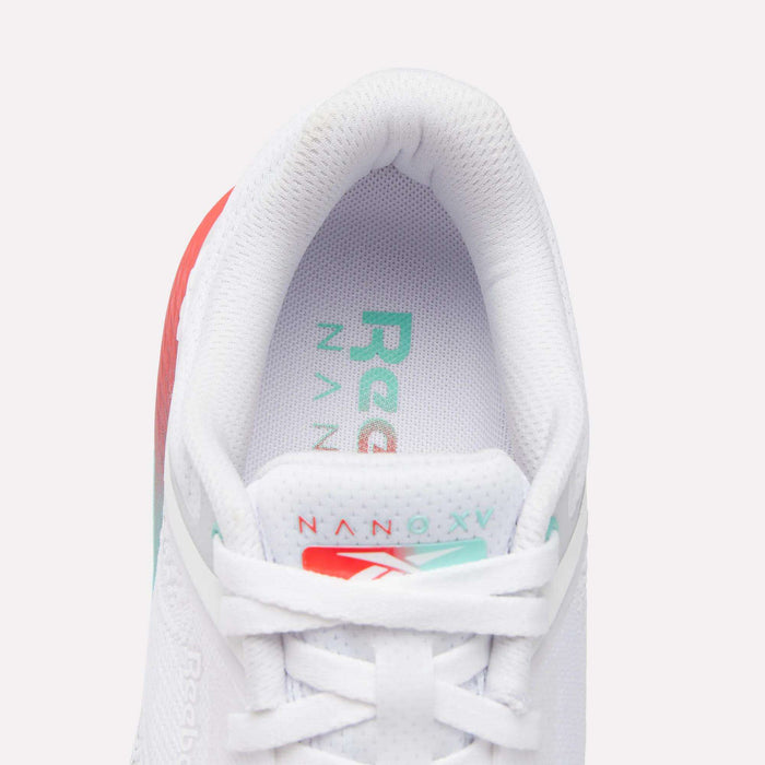 A close-up top view of the Reebok Women's Nano X5 Training Shoes, featuring a padded collar, white laces, comfortable upper, and an insole displaying the Nano X1 logo in green and red. Part of the heel is also visible.