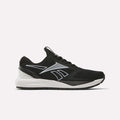 The Reebok Women’s NFX Trainer 2 Training Shoes feature a black mesh upper, white sole, and a silver Reebok logo on the side. Shown against a plain white background, these versatile training shoes are perfect for daily gym sessions or intense workout routines.