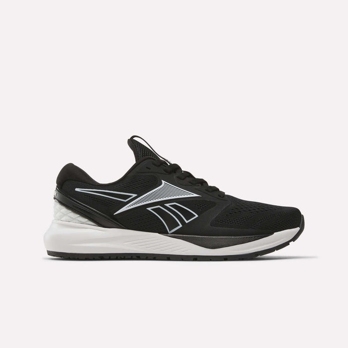 The Reebok Women’s NFX Trainer 2 Training Shoes feature a black mesh upper, white sole, and a silver Reebok logo on the side. Shown against a plain white background, these versatile training shoes are perfect for daily gym sessions or intense workout routines.