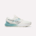 The Reebok Women's Nanoflex 2.0 Training Shoes are showcased in a side profile against a plain white background, featuring a mesh upper in Chalk with Hazy Teal and Midnight Tide accents, a black-outlined logo, and a cushioned sole—making them an ideal choice for women's workout or training sessions.
