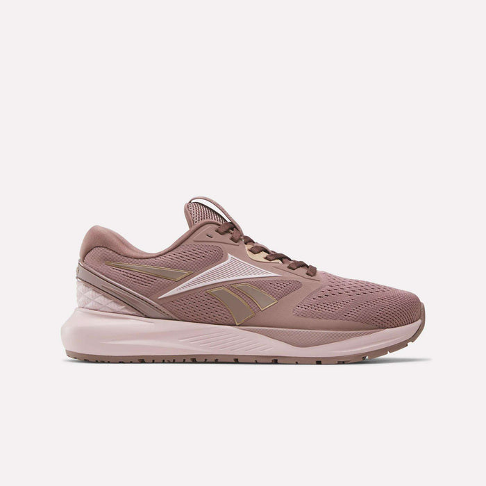 The Women's Nanoflex 2.0 Training Shoes by Reebok feature mauve pink mesh, a reinforced heel, white and gold Reebok logo, cushioned sole, and lace-up closure—perfect stylish workout shoes for women. Shown on a plain white background.