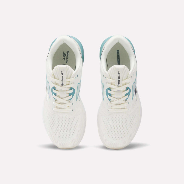 A pair of Reebok Women's Nanoflex 2.0 Training Shoes in white with teal accents, shown from above. These versatile workout shoes feature lace-up fronts and display the Reebok logo on the tongues and insoles.