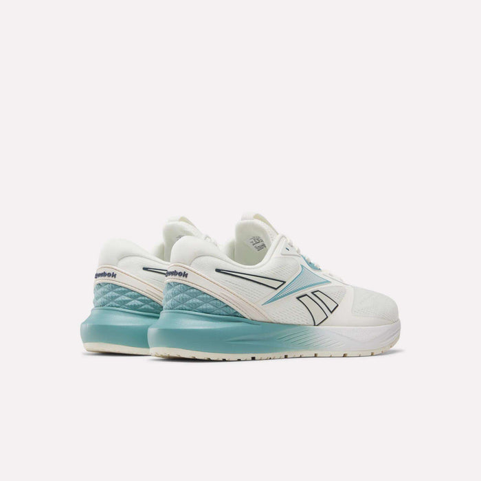 Two white Women's Nanoflex 2.0 Training Shoes by Reebok with teal accents are displayed on a white background, seen from the back and side to highlight the Reebok logo and gradient teal heel design. Ideal as women's training footwear, these stylish Reebok workout shoes combine comfort and performance for your active lifestyle.
