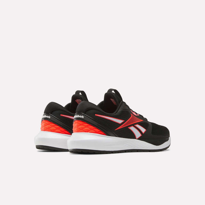 A pair of Women's Nanoflex 2.0 Training Shoes by Reebok in black with red and white accents, perfect for workouts, shown from the back and side on a plain white background.