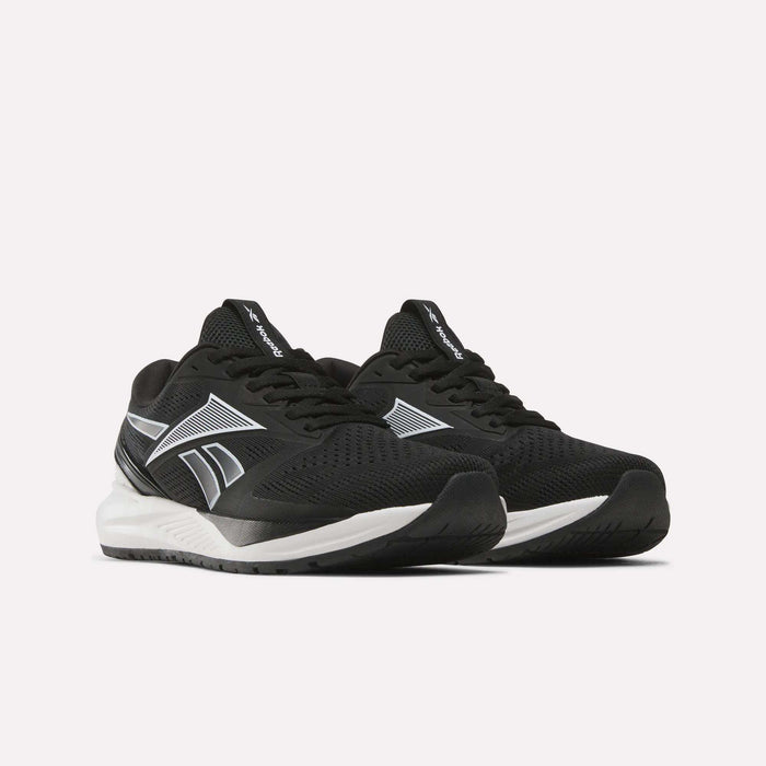A pair of Reebok Women’s NFX Trainer 2 Training Shoes in black with white soles and silver accents, displayed on a plain white background.