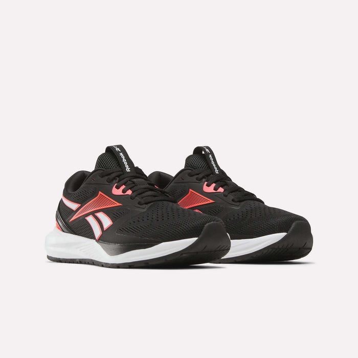 The Women's Nanoflex 2.0 Training Shoes by Reebok feature black uppers, white soles, and red accents—shown side by side on a light background—ideal for women's training sessions.