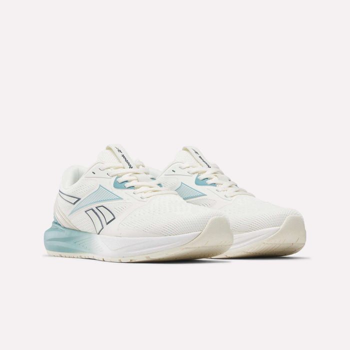 A pair of Reebok Women's Nanoflex 2.0 Training Shoes in white with light blue accents and a blue logo, displayed at an angle to showcase the sides and front against a plain white background—these athletic sneakers are ideal for training or as dependable workout footwear.