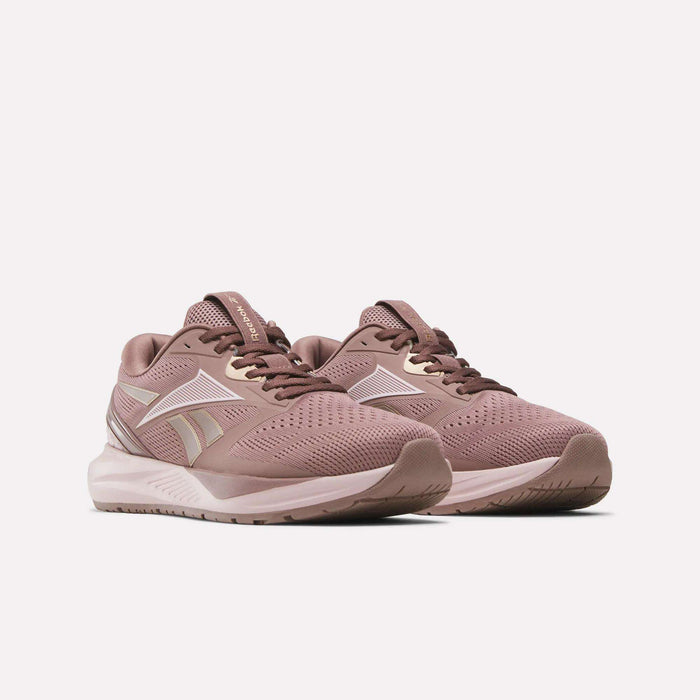 A pair of Reebok Women's Nanoflex 2.0 Training Shoes in mauve pink with white accents and mesh uppers shown on a plain white background.