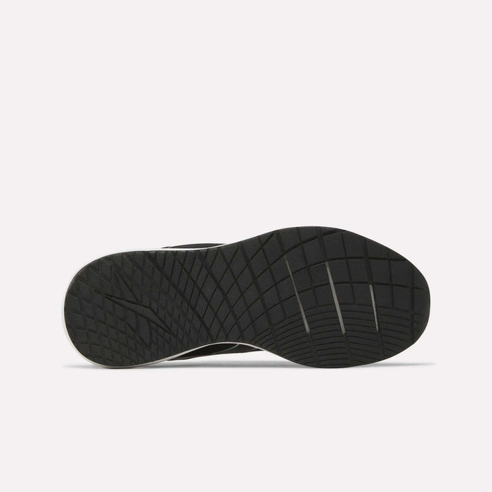 The image displays the black rubber outsole of the Reebok Women’s NFX Trainer 2 Training Shoes, featuring a grid and line tread pattern designed for traction, set against a plain white background.