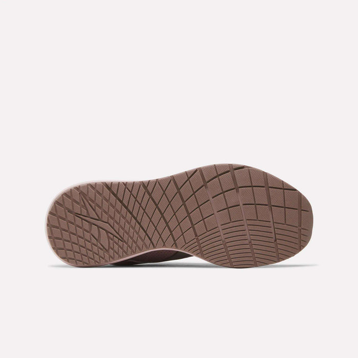 The image displays the sole of a Women's Nanoflex 2.0 Training Shoe by Reebok, featuring a textured, grid-like brown tread, viewed from directly below on a plain white background.