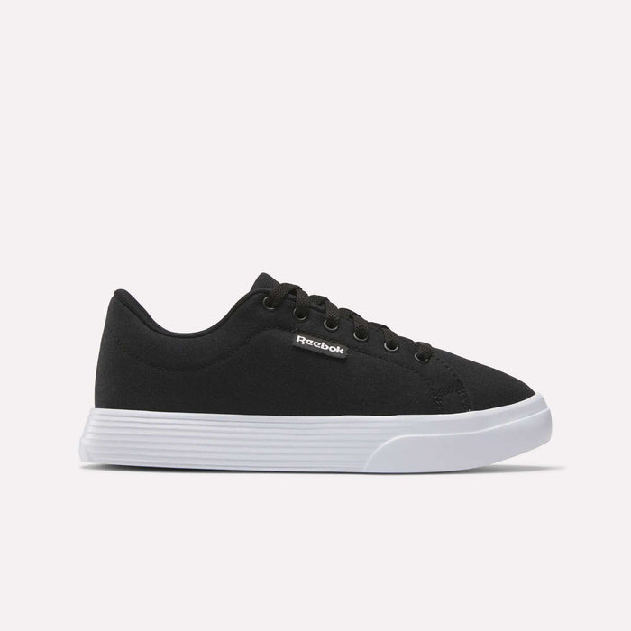 The Reebok Women's OnLux Court Lite Walking Shoes feature a black design with black laces and a white rubber sole, displayed in side profile on a light background—ideal for comfortable all-day walking.