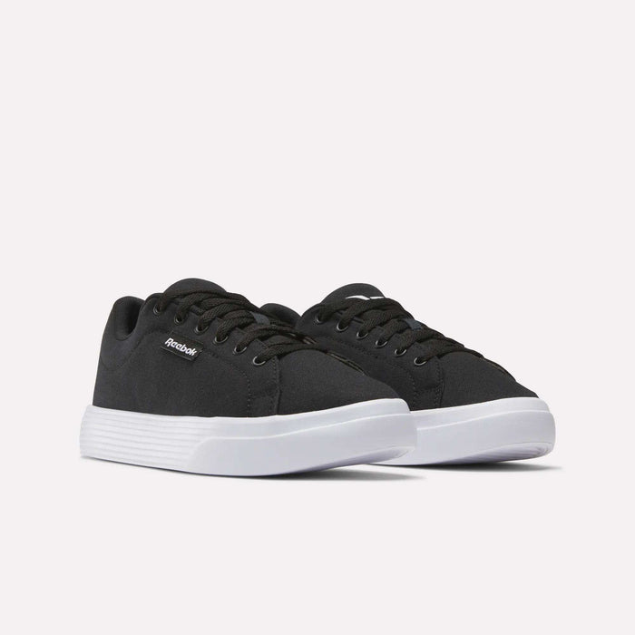 A pair of black Reebok Women's OnLux Court Lite Walking Shoes with white soles and black laces, side by side on a plain white background—ideal for anyone seeking comfortable walking shoes.