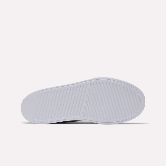 The image displays the sole of Reebok Women's OnLux Court Lite Walking Shoes in white, featuring a herringbone and linear tread against a plain background—perfect for comfortable walks.
