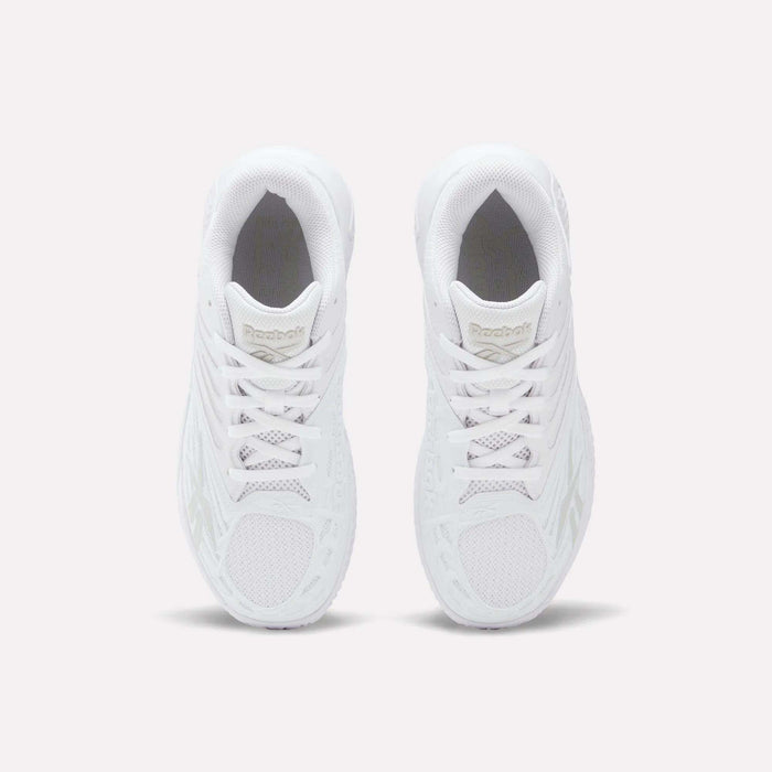 A pair of Women's Phase Evo Tennis Shoes by Reebok, shown in white from above, displaying the laces, mesh accents, and Reebok branding on the tongues.