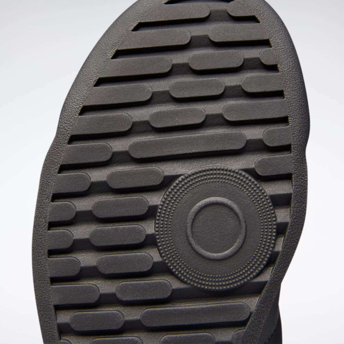 Close-up of the sole on Reebok Women's Princess Shoes, highlighting raised horizontal lines and a circular textured pattern near the center.