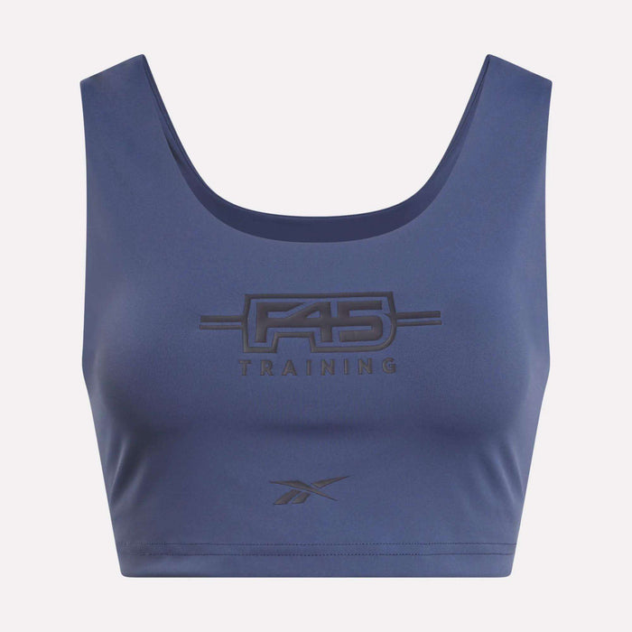 A Women's Reebok x F45 Training Sports Bra in blue, showcasing bold F45 Training branding and the Reebok logo on the front.