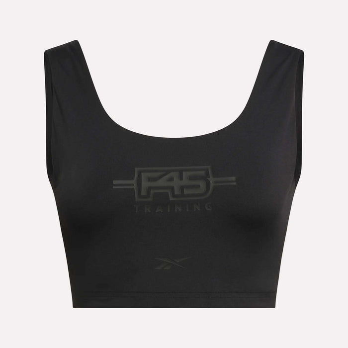 The Women's Reebok x F45 Training Sports Bra is a black athletic crop top with wide straps, showcasing the F45 Training logo across the chest and a small Reebok logo near the bottom hem. Designed for versatility, this piece combines supportive performance with stylish details to complement your active lifestyle.