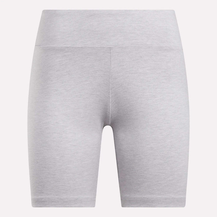 The Reebok Women's Small Logo Cycle Shorts are light gray and high-waisted, crafted from smooth, stretchy fabric with a seamless look against a plain white background. They feature a subtle design with no prominent logos or patterns.
