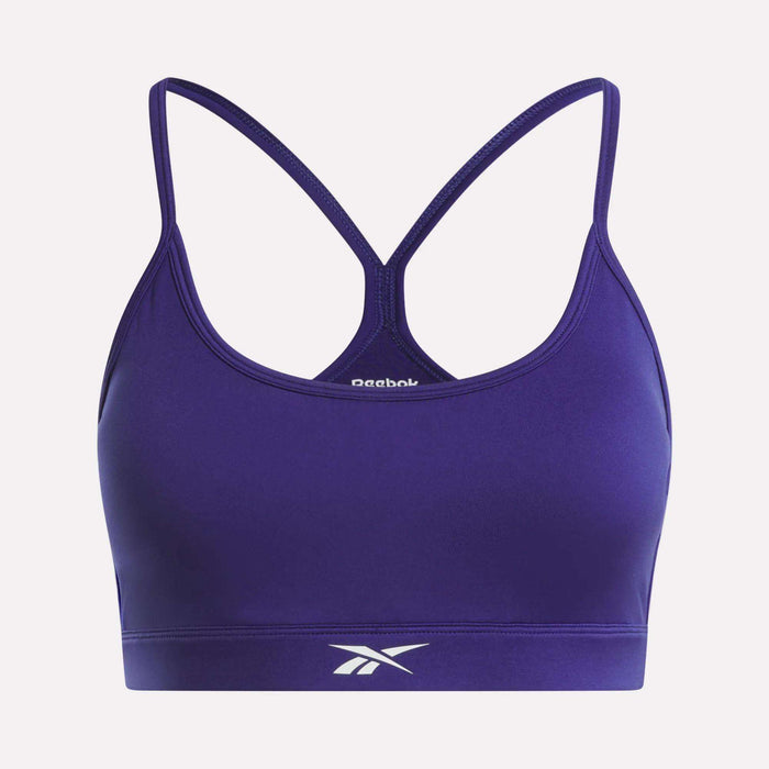 The Reebok Women's Strappy Sports Bra features a racerback design with spaghetti straps and the iconic logo on the front band. Made from quick-drying fabric, it's ideal for medium-impact workouts.
