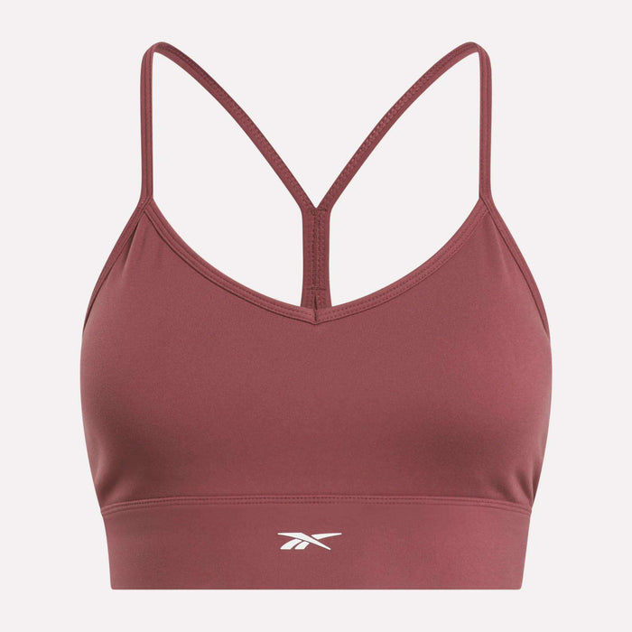 The Reebok Women's Back Bra is a maroon medium-impact sports bra with thin racerback straps and a white front center logo, shown on a plain white background.