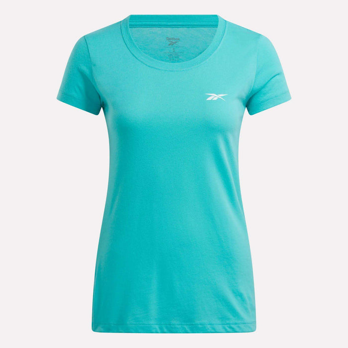A teal Reebok women's cotton t-shirt with short sleeves, a round neckline, and a small white logo on the left chest is shown against a plain white background.