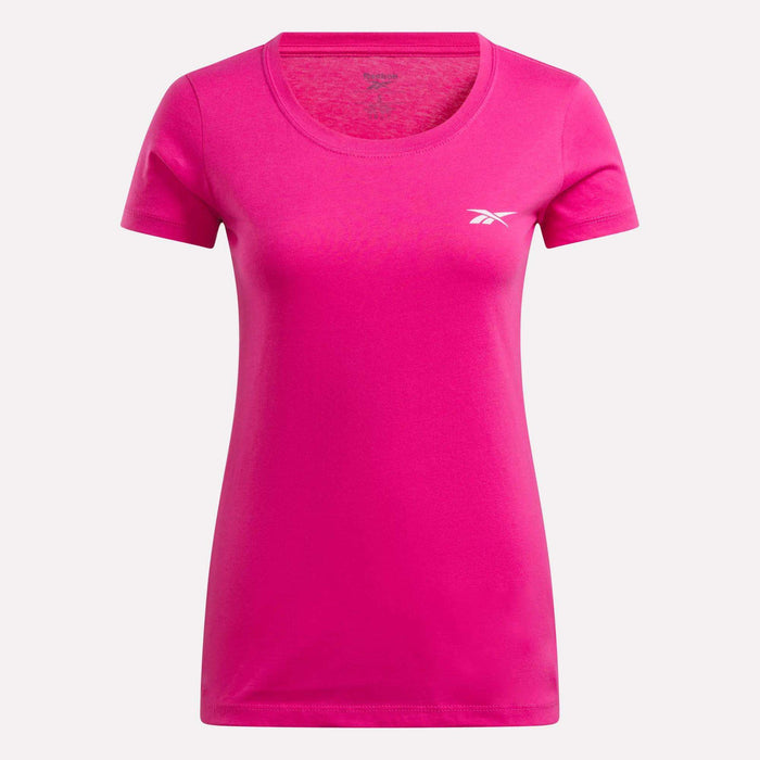 The Reebok Women's T-Shirt is bright pink with short sleeves, a fitted cut, round neckline, and a small white Reebok logo on the left chest, shown on a plain light background.