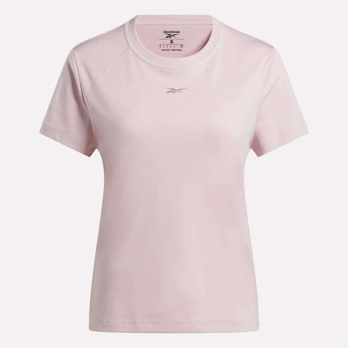 The Reebok Women's Training T-Shirt, shown in light pink with short sleeves and a round neckline, features RBK-DRY moisture-control fabric and a small chest logo, displayed on a plain white background.