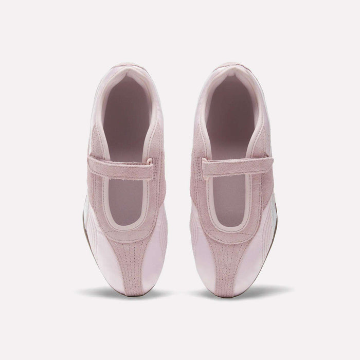A pair of Women's Ultra Lo Mary Jane Shoes by Reebok in light pink with velcro straps, styled as low-profile runners, shown from above on a plain white background.