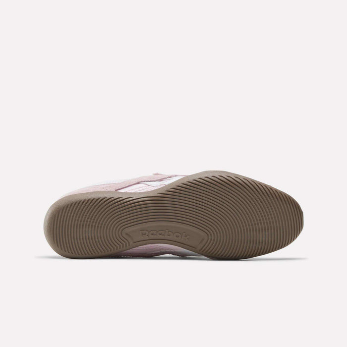 The Women's Ultra Lo Mary Jane Shoes by Reebok in pink feature a low-profile design, a textured brown rubber sole, and the Reebok logo embossed in the arch—classic everyday comfort with modern style.