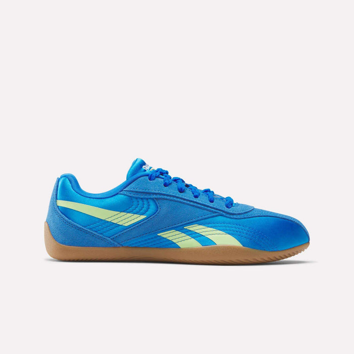 The Reebok Women's Ultra Lo Shoes are blue lightweight athletic sneakers with light green stripes, a gum sole, and matching blue laces. Shown in a side profile view on a plain white background.