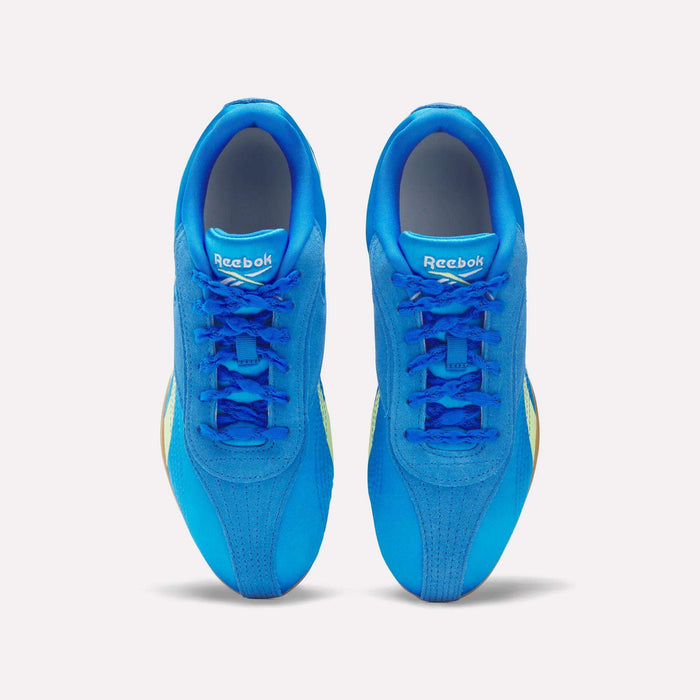 A pair of Women's Ultra Lo Shoes by Reebok in bright blue, shown from above with laces, logoed tongues, and rounded toe caps. These lightweight sneakers are displayed on a plain white background.