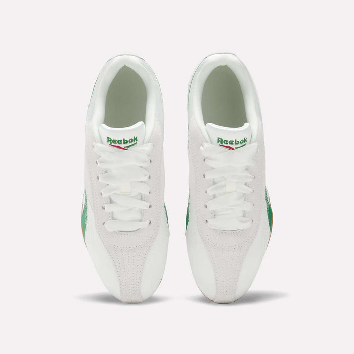 Top view of Women's Ultra Lo Shoes by Reebok: white sneakers with green accents and gum soles, placed side by side on a light background, featuring the visible Reebok logo on each tongue.