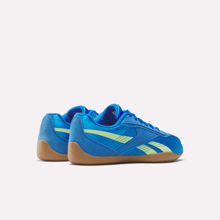 The Reebok Women's Ultra Lo Shoes are blue lightweight athletic sneakers with neon yellow stripes and tan rubber soles, shown on a white background. Both low-profile shoes are side by side, angled slightly away from the viewer.